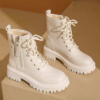 Bottes Martin™ pour femmes avec finition en cuir lisse.